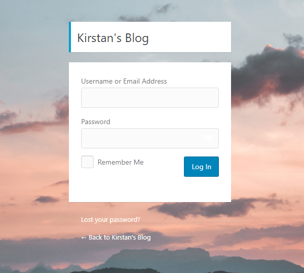 Screenshot of a customized login screen with a background image showing a sunset.